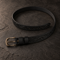 The Midnight Black Tooled Belt laid open, showing the full strap and keeper loop.