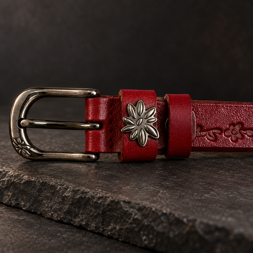 Detail of the gunmetal-and-nickel buckle and star medallion on the Bordeaux Tooled Belt.