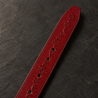 Detail of the belt tip on the DIRATH Tooled Belt in Bordeaux.