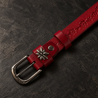 The Bordeaux Tooled Belt fastened, showing the gunmetal-and-nickel buckle in use.