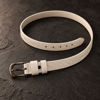 The Ivory Tooled Belt laid open, showing the full strap and keeper loop.